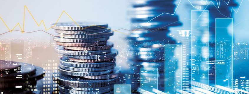 Stacks of coins with a cityscape background symbolize financial growth. Overlay of graphs indicates economic trends and fluctuating market dynamics.