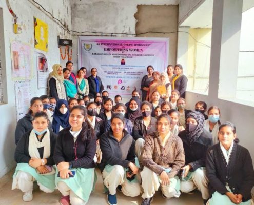 Group of people in a classroom gathering for an "Empowering Women" workshop at Karamat Husain Muslim Girls' PG College, Lucknow.