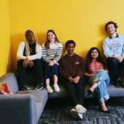 A group sits on the couch.