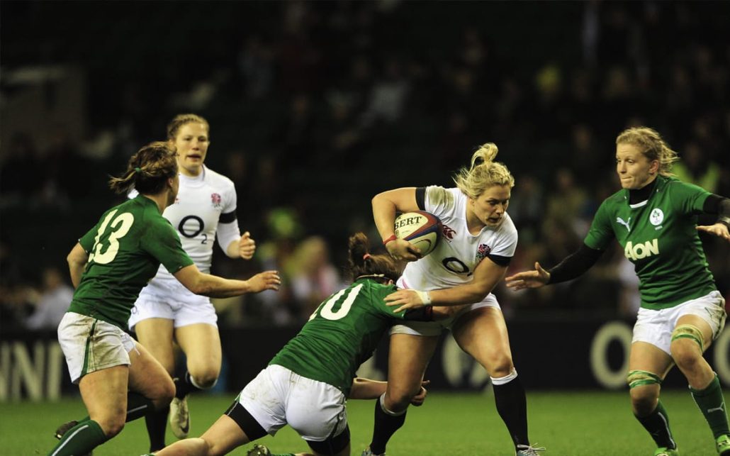 A group is playing rugby.