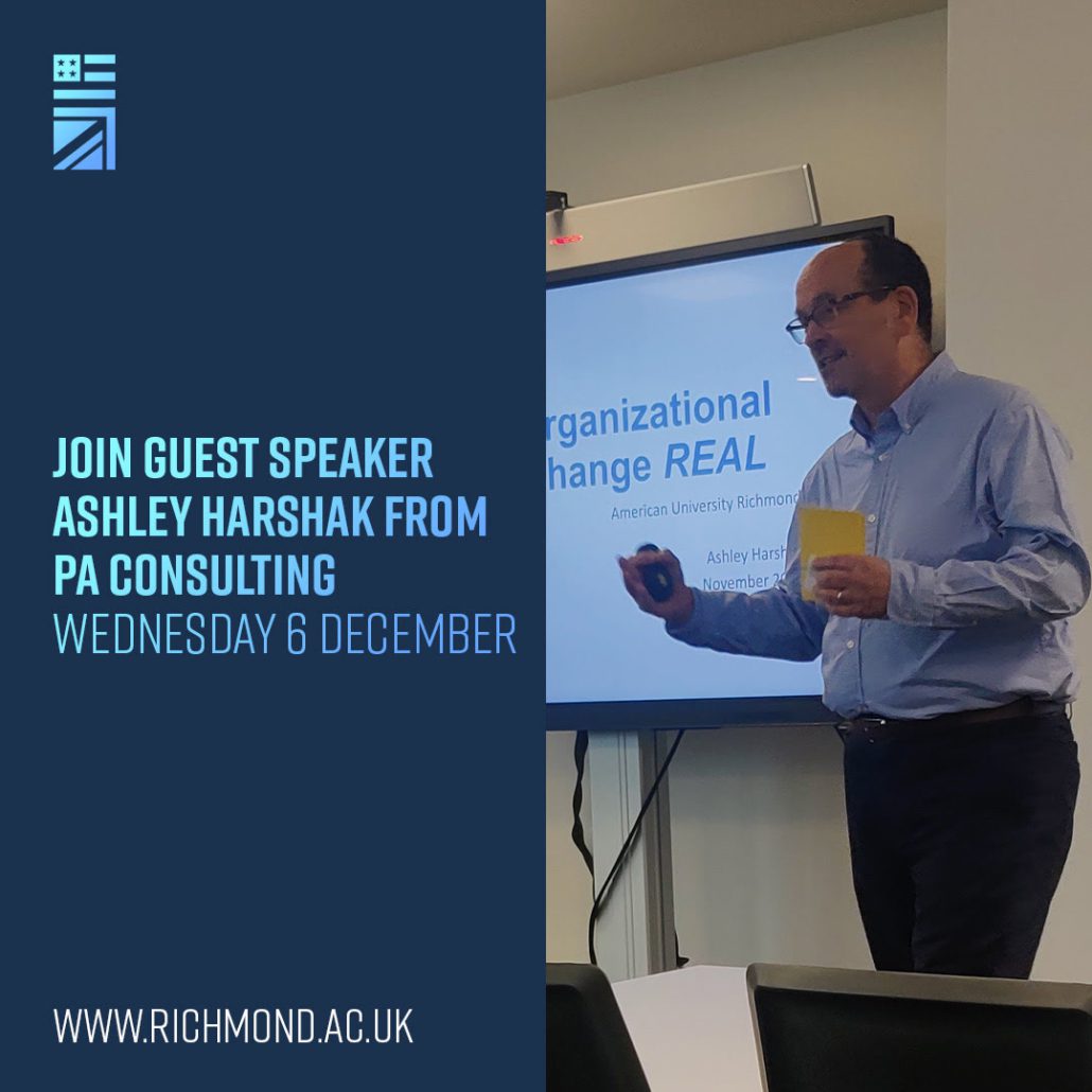 A person is presenting with a slide titled "Organizational Change REAL" in a room. An invitation banner includes event details for December.