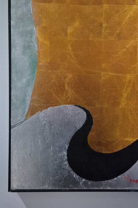 Abstract painting with textured golden, silver, and black shapes. A blend of geometric forms creates a dynamic composition within a black frame.