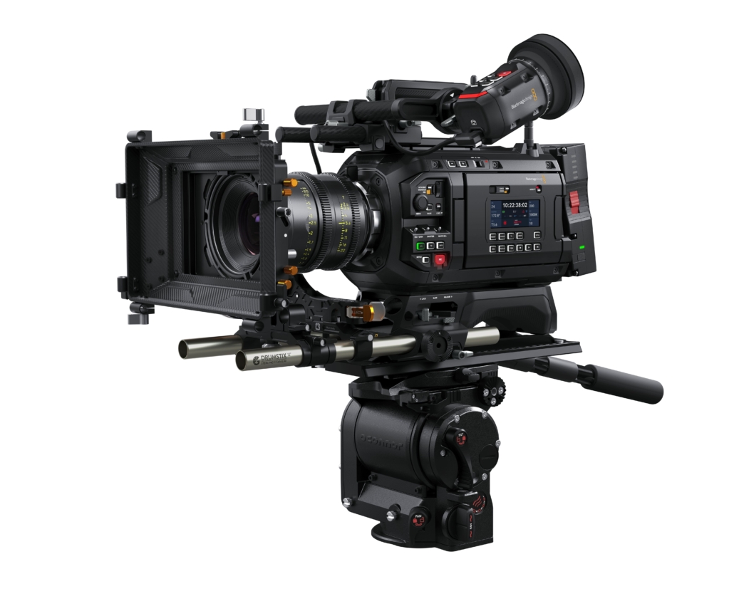 A professional cinema camera setup with lens, matte box, and controls, mounted on a tripod head, ideal for filmmaking and video production.