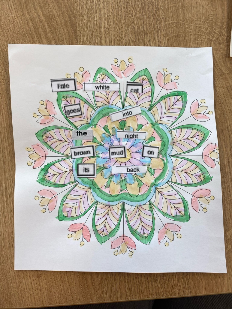 A colorful mandala design with magnetic poetry words arranged to form a whimsical sentence about a cat in the night.