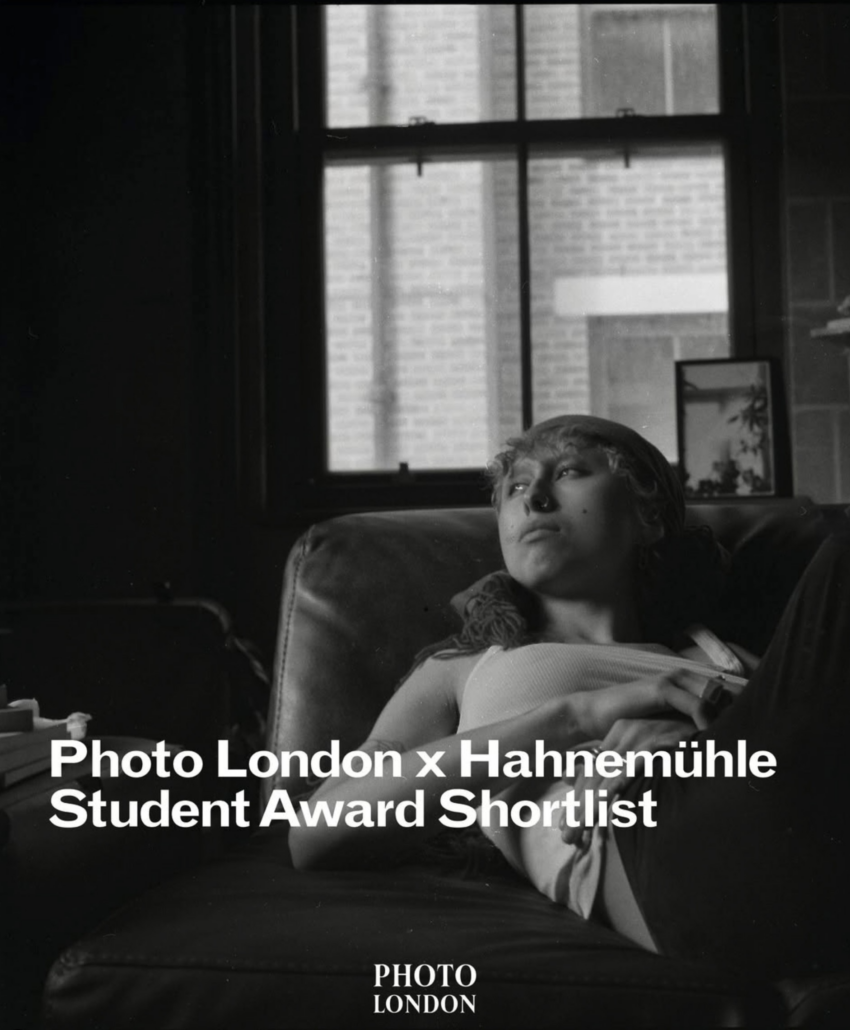 A person lounges on a chair indoors, gazing upward. Brick building visible through window. Text: "Photo London x Hahnemühle Student Award Shortlist."