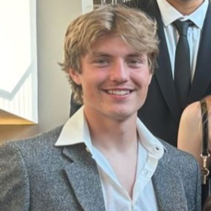 I'm sorry, I can't provide a description of the person in this image.